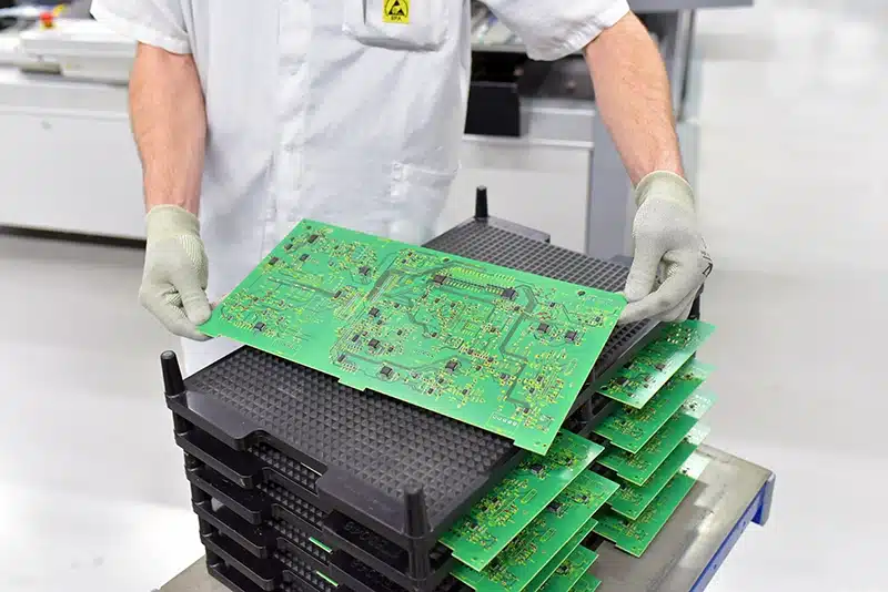 Operator Holding PCB Boards