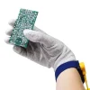 Operator Wearing GT Anti Static Glove With Coated Fingertips Holding A PCB Component and Wearing An ESD Wrist Strap and Cord - Bondline Electronics Ltd