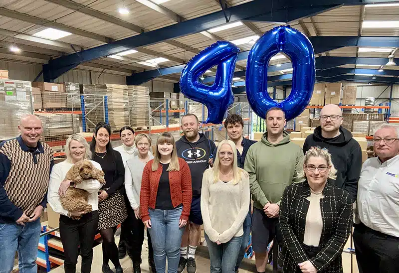 Bondline team photo celebrating 40th anniversary